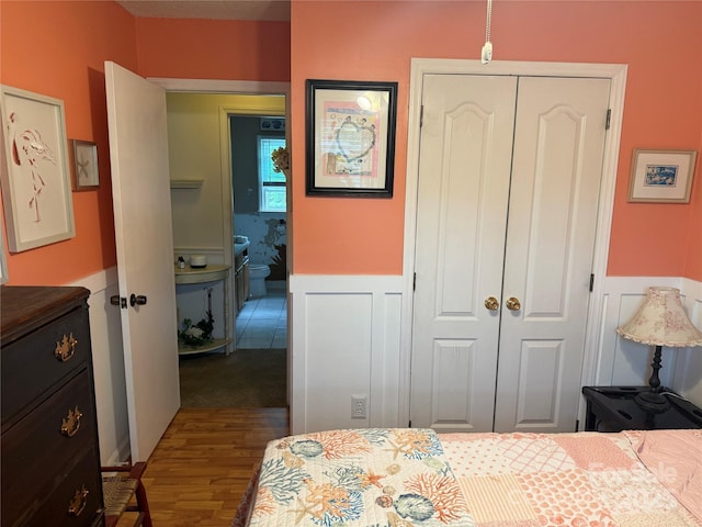 1895 Sandy Cir, Newton, NC 28658 - bedroom featuring a closet, a wainscoted wall, and dark wood finished floors