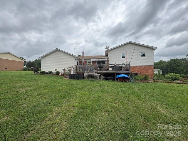 1895 Sandy Cir, Newton, NC 28658 - back of house with a deck, brick siding, and a lawn