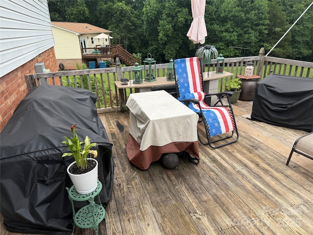 1895 Sandy Cir, Newton, NC 28658 - wooden terrace featuring a grill, a forest view, and outdoor dining space