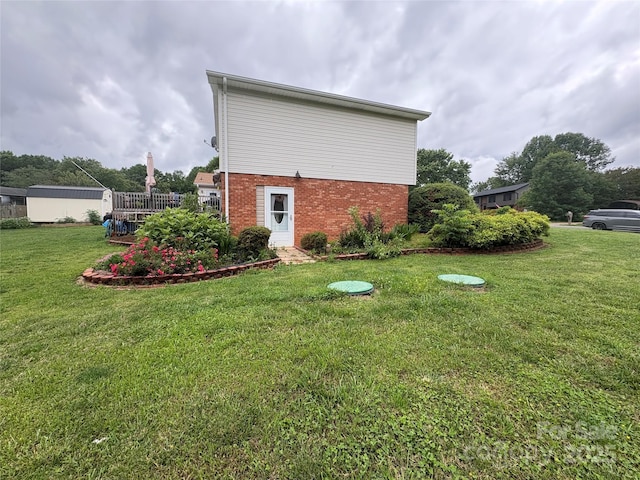 1895 Sandy Cir, Newton, NC 28658 - view of property exterior with brick siding and a lawn