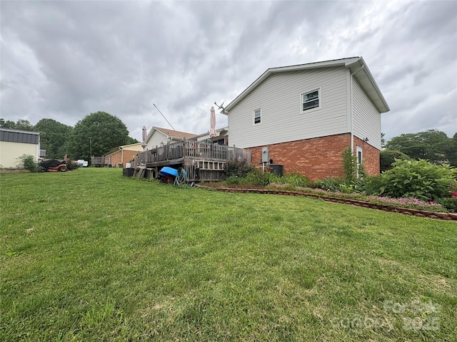 1895 Sandy Cir, Newton, NC 28658 - back of house featuring brick siding and a lawn