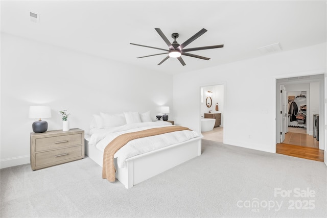 126 Still Creek Dr, Mooresville, NC 28115 - carpeted bedroom with baseboards, ensuite bath, and ceiling fan