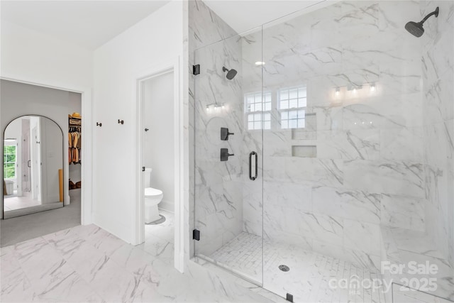 126 Still Creek Dr, Mooresville, NC 28115 - full bathroom with a marble finish shower, toilet, a walk in closet, marble finish flooring, and baseboards