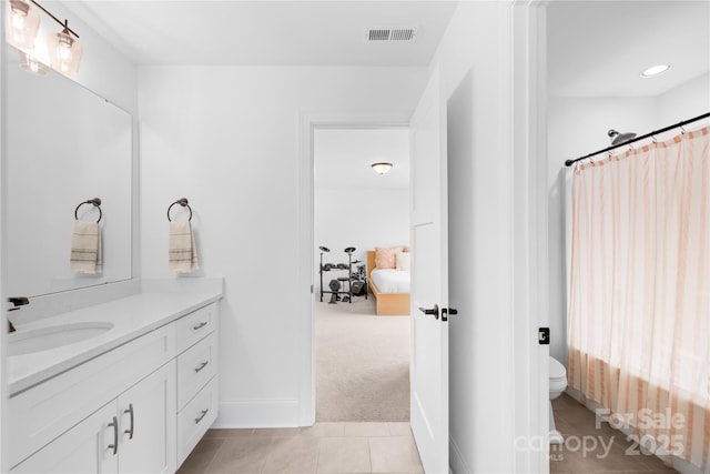 126 Still Creek Dr, Mooresville, NC 28115 - ensuite bathroom with vanity, toilet, a shower with curtain, baseboards, and tile patterned flooring