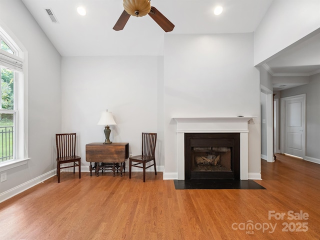 10875 Casetta Dr, Matthews, NC 28105 - sitting room with ceiling fan, wood finished floors, recessed lighting, and a fireplace with flush hearth
