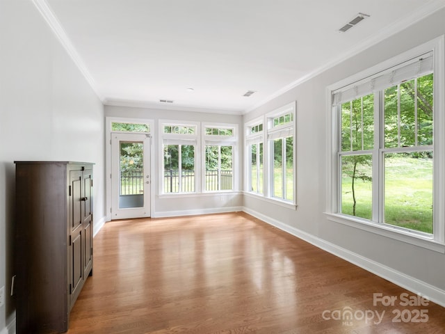 10875 Casetta Dr, Matthews, NC 28105 - unfurnished sunroom with crown molding, wood finished floors, and french doors