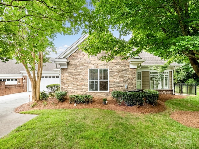 10875 Casetta Dr, Matthews, NC 28105 - view of front of property featuring stone siding, driveway, an attached garage, and roof with shingles