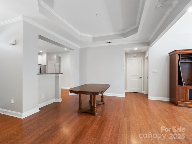 10875 Casetta Dr, Matthews, NC 28105 - unfurnished room featuring a tray ceiling, wood finished floors, a smoke detector, ornamental molding, and recessed lighting