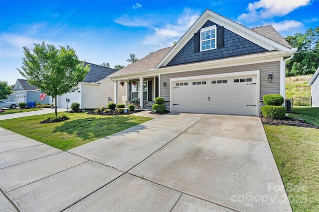 7809 Creek Park Dr, Denver, NC 28037 - view of front facade with a front lawn, concrete driveway, a garage, and stone siding
