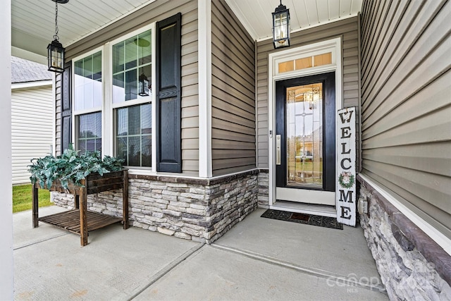 7809 Creek Park Dr, Denver, NC 28037 - view of exterior entry featuring a porch and stone siding