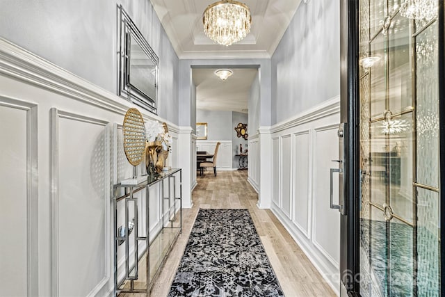 7809 Creek Park Dr, Denver, NC 28037 - foyer entrance featuring a chandelier, a decorative wall, light wood-type flooring, wainscoting, and crown molding