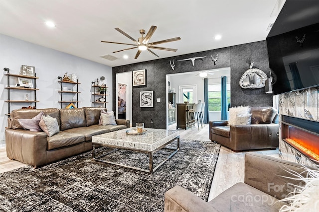 7809 Creek Park Dr, Denver, NC 28037 - living area with a ceiling fan, wood finished floors, a premium fireplace, and recessed lighting