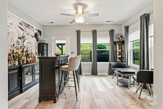 7809 Creek Park Dr, Denver, NC 28037 - indoor dry bar with light wood finished floors, a ceiling fan, and wine cooler