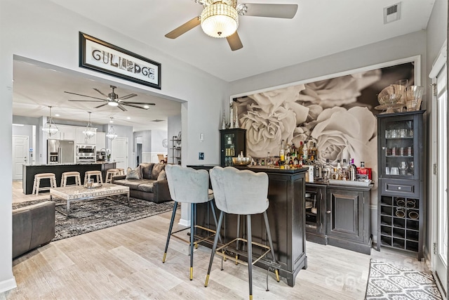 7809 Creek Park Dr, Denver, NC 28037 - indoor dry bar with a ceiling fan, high end refrigerator, light wood finished floors, and pendant lighting