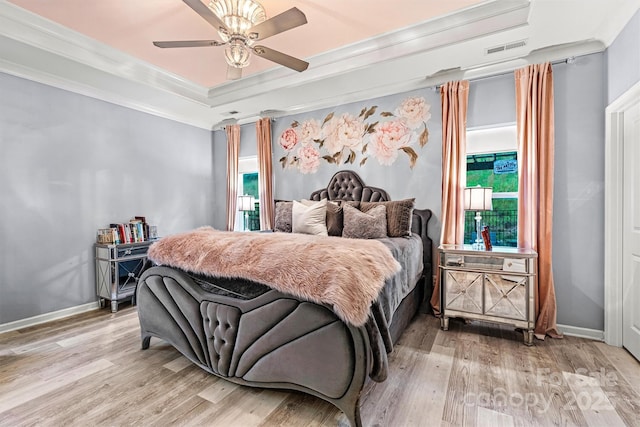 7809 Creek Park Dr, Denver, NC 28037 - bedroom with light wood finished floors, crown molding, a raised ceiling, baseboards, and ceiling fan