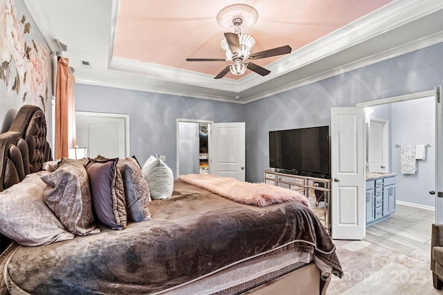 7809 Creek Park Dr, Denver, NC 28037 - bedroom featuring a raised ceiling, crown molding, light wood finished floors, baseboards, and a ceiling fan