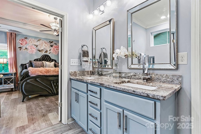 7809 Creek Park Dr, Denver, NC 28037 - bathroom featuring double vanity, wood finished floors, healthy amount of natural light, ceiling fan, and ornamental molding