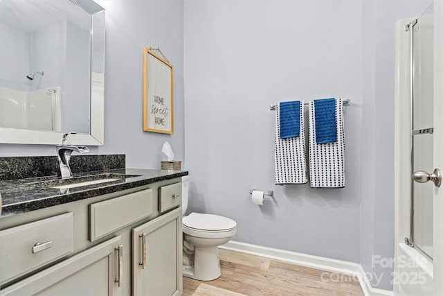 7809 Creek Park Dr, Denver, NC 28037 - bathroom with vanity, wood finished floors, toilet, and baseboards