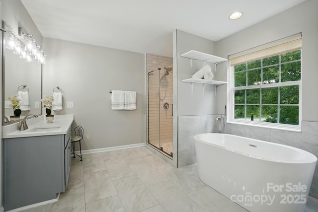 415 Glandon Ct, Fort Mill, SC 29708 - full bathroom featuring marble finish flooring, vanity, a shower stall, and a freestanding tub