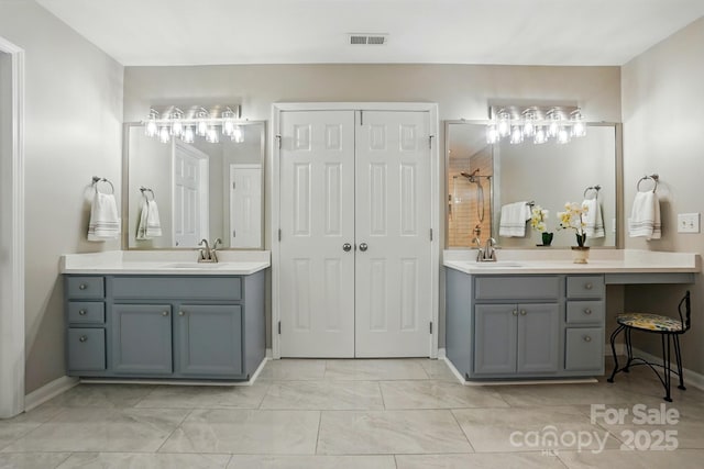415 Glandon Ct, Fort Mill, SC 29708 - full bathroom with two vanities, tiled shower, marble finish floors, and baseboards