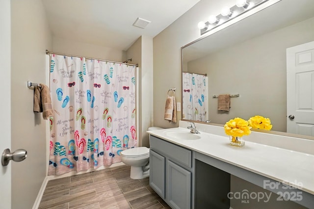 415 Glandon Ct, Fort Mill, SC 29708 - bathroom with vanity, toilet, wood finished floors, curtained shower, and baseboards