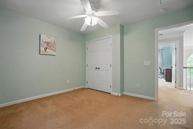415 Glandon Ct, Fort Mill, SC 29708 - unfurnished bedroom with light colored carpet, baseboards, attic access, a closet, and a ceiling fan