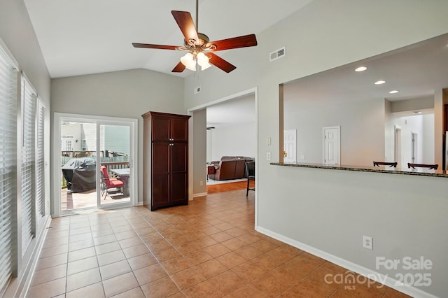 415 Glandon Ct, Fort Mill, SC 29708 - empty room featuring a ceiling fan, high vaulted ceiling, light tile patterned floors, baseboards, and recessed lighting