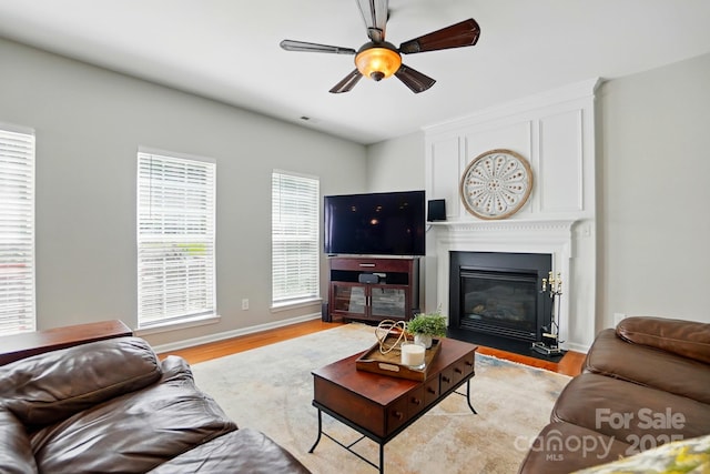 415 Glandon Ct, Fort Mill, SC 29708 - living room featuring light wood-style flooring, ceiling fan, a large fireplace, and baseboards