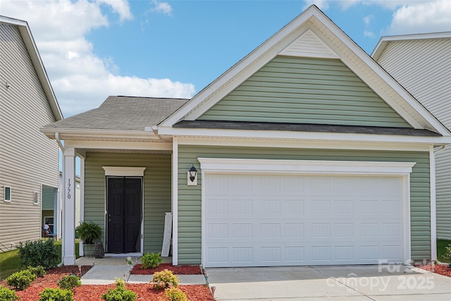 1770 Troon Dr, Salisbury, NC 28144 - view of front facade with driveway, a garage, roof with shingles, and covered porch