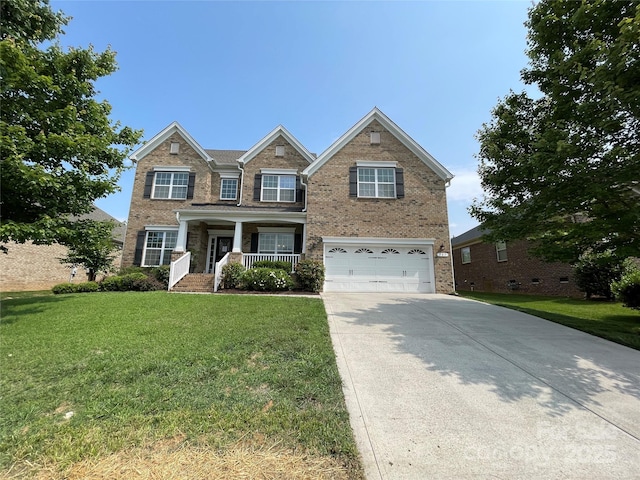 707 Five Leaf Ln, Waxhaw, NC 28173 - traditional home featuring covered porch, concrete driveway, brick siding, and a front lawn