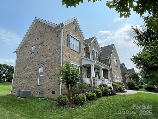 707 Five Leaf Ln, Waxhaw, NC 28173 - view of property exterior with a lawn, brick siding, crawl space, and central air condition unit