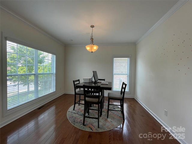 707 Five Leaf Ln, Waxhaw, NC 28173 - dining area with dark wood finished floors, crown molding, and baseboards