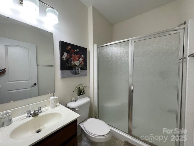 707 Five Leaf Ln, Waxhaw, NC 28173 - bathroom featuring a stall shower, vanity, and toilet