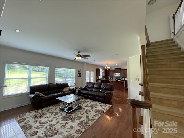 707 Five Leaf Ln, Waxhaw, NC 28173 - living room with stairs, a ceiling fan, plenty of natural light, and dark wood-type flooring