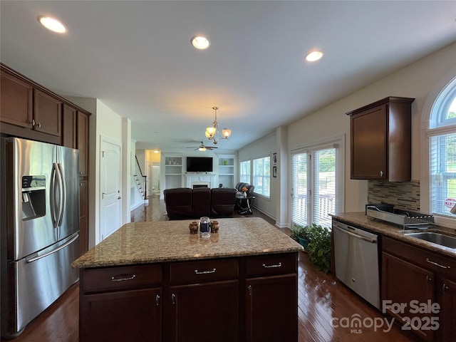 707 Five Leaf Ln, Waxhaw, NC 28173 - kitchen with stainless steel appliances, healthy amount of natural light, a sink, dark wood-type flooring, and recessed lighting