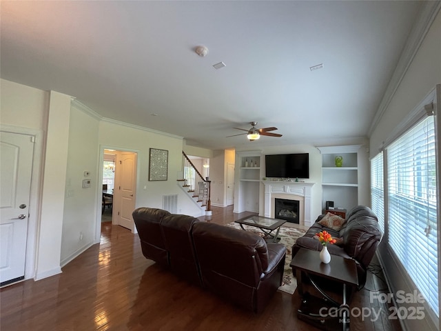707 Five Leaf Ln, Waxhaw, NC 28173 - living room with plenty of natural light, stairs, a ceiling fan, dark wood-style flooring, and crown molding