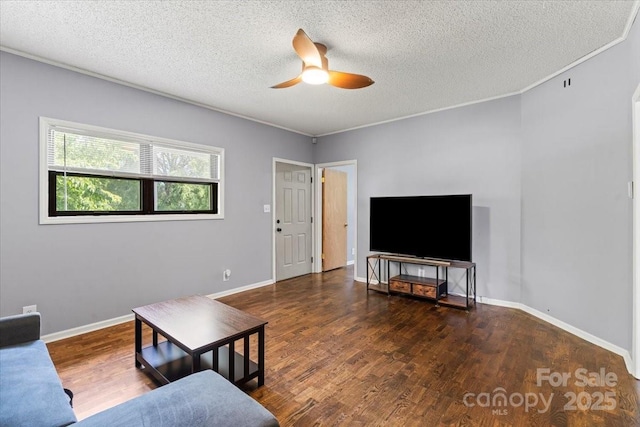 935 Church St, Kings Mountain, NC 28086 - living room featuring a ceiling fan, a textured ceiling, wood finished floors, and baseboards