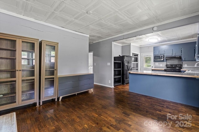 935 Church St, Kings Mountain, NC 28086 - kitchen with black appliances, an ornate ceiling, dark wood-style flooring, a peninsula, and under cabinet range hood
