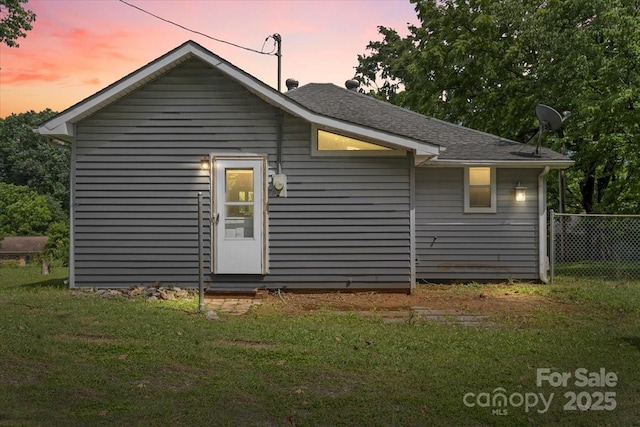 935 Church St, Kings Mountain, NC 28086 - back of property at dusk with entry steps and a shingled roof