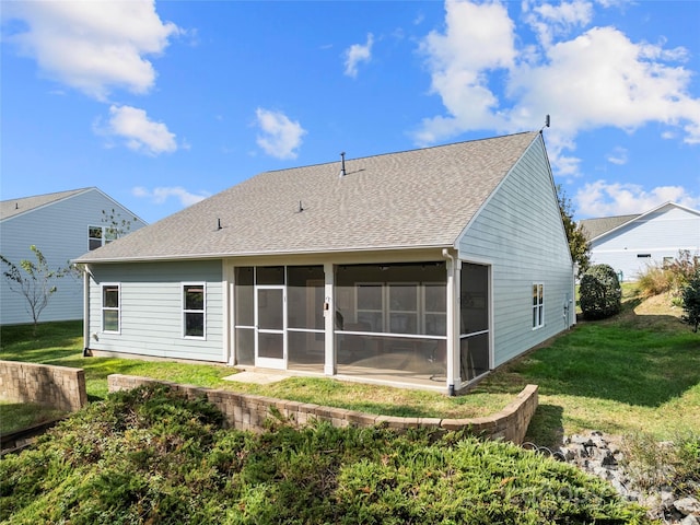 25566 Seagull Dr, Lancaster, SC 29720 - back of house featuring a sunroom, a yard, and a shingled roof