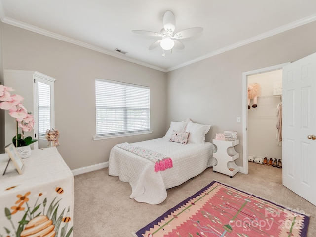 537 Montgrove Pl NW, Concord, NC 28027 - bedroom featuring light carpet, crown molding, baseboards, ceiling fan, and a walk in closet
