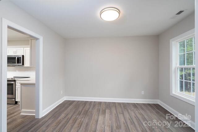 248 Pioneer Dr, Mount Gilead, NC 27306 - empty room featuring dark wood-type flooring and baseboards