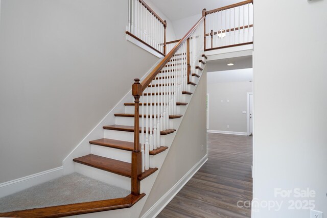 248 Pioneer Dr, Mount Gilead, NC 27306 - stairs featuring wood finished floors and baseboards