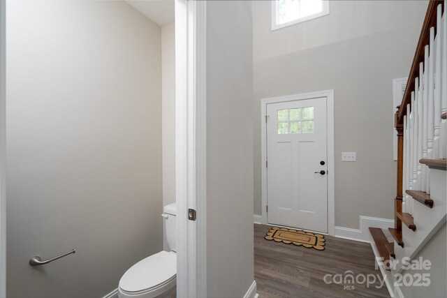 248 Pioneer Dr, Mount Gilead, NC 27306 - foyer entrance with stairs and wood finished floors