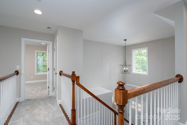 248 Pioneer Dr, Mount Gilead, NC 27306 - hallway with an upstairs landing, carpet flooring, a chandelier, and recessed lighting