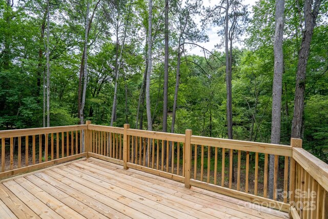 248 Pioneer Dr, Mount Gilead, NC 27306 - wooden deck with a view of trees