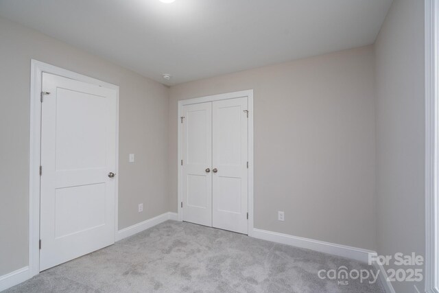 248 Pioneer Dr, Mount Gilead, NC 27306 - unfurnished bedroom with light carpet and a closet