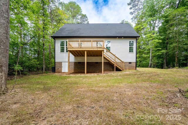 248 Pioneer Dr, Mount Gilead, NC 27306 - back of property with stairway, crawl space, a deck, a lawn, and a shingled roof