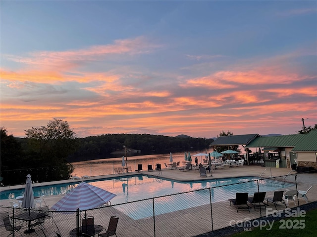 248 Pioneer Dr, Mount Gilead, NC 27306 - pool at dusk with a community pool and a patio