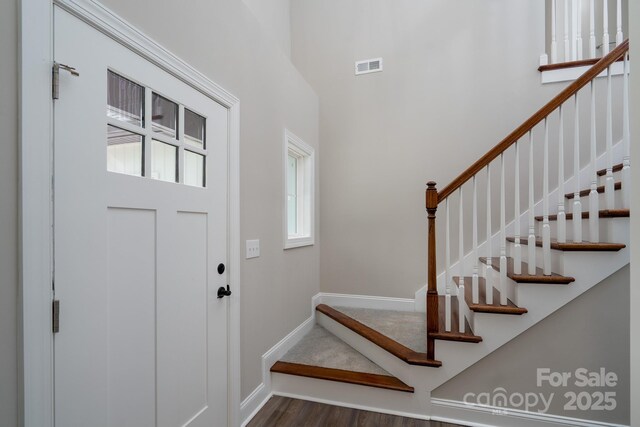 248 Pioneer Dr, Mount Gilead, NC 27306 - entrance foyer featuring wood finished floors, stairs, and a high ceiling
